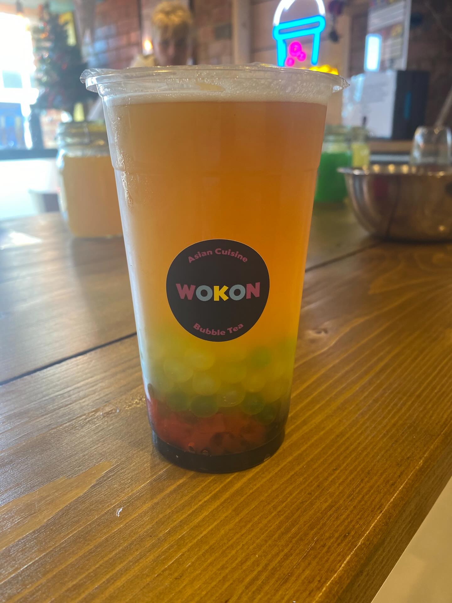 Layered fruit bubble tea with popping balls
