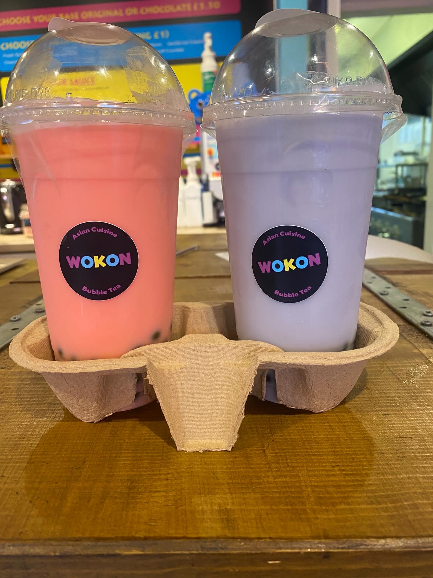 Two fresh milkshakes with domed lids